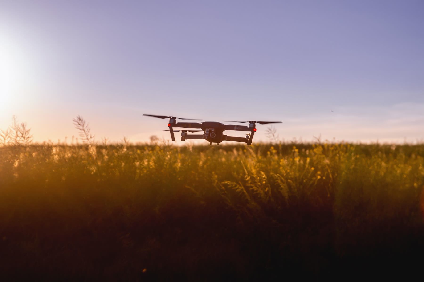 Inspection drone in flight at sunset